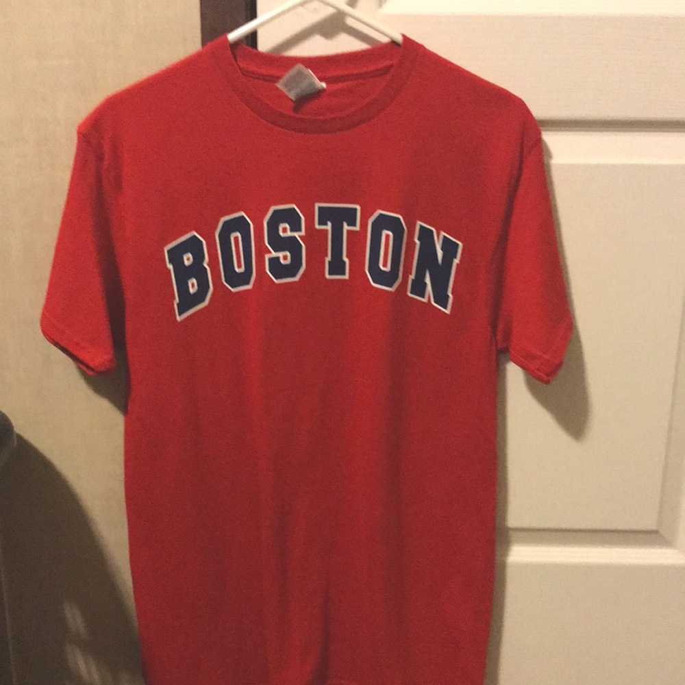 A red Boston tee shirt. Never worn. Great condition.